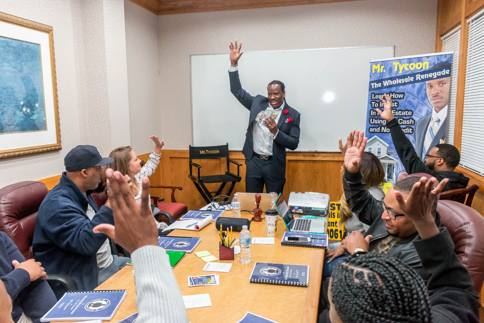 Students raising their hands during a session